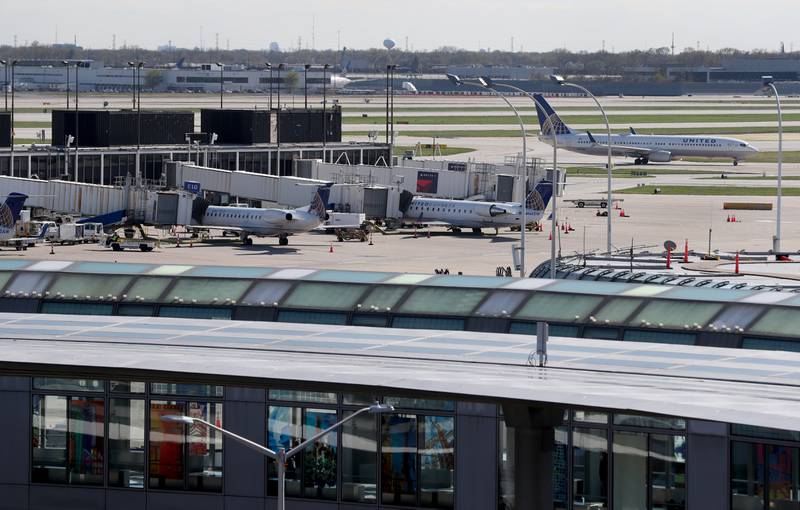 Construction worker operating heavy machinery on a large job site, emphasizing construction equipment.